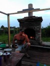 барбекю на улице по типу камина из старого кирпича с дровником...