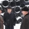 Л.Г. Михайлов на фоне продукции завода